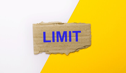 On a white and yellow background, brown torn cardboard with the text LIMIT
