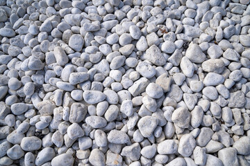 Grey rocks and pebbles on the shore of Lake Michigan, useful for backgrounds