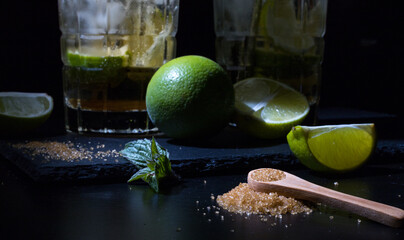 Some drinks with brown sugar  on a black background