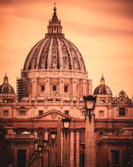 Dome of Saint Peter's cathedral basking in sunset, Rome, Italy. 