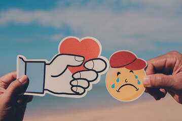 A paper-cut hand extending heart for crying face on a beautiful sky, Friendship, Friendly, World...