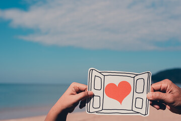 Hands holding paper cut of heart in window,encouragement,world mental health day,sharing,organ or...