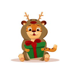 Fototapeta premium Cartoon festive little tiger dressed as a deer sitting and holding a gift in a box with a bow. Year of the Chinese Tiger.