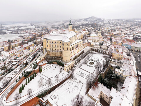 Aerial view of Zamek Mikulov castle, a baroque palace in wintertime with snow in Mikulov, Czech Republic.