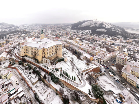 Aerial view of Zamek Mikulov castle, a baroque palace in wintertime with snow in Mikulov, Czech Republic.