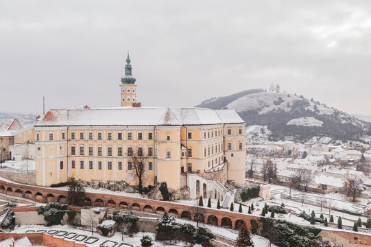 Aerial view of Zamek Mikulov castle, a baroque palace in wintertime with snow in Mikulov, Czech Republic.