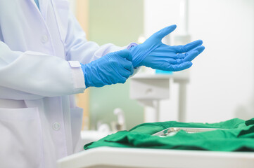 Female dentist wearing medical gloves Prepare to work in a dental clinic, dental concepts and healthcare.