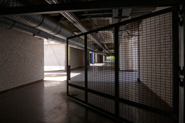 old abandoned factory with sunshine and open gate