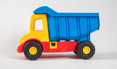 Fototapeta premium Truck. Plastic toy multicolored cars isolated on white background.
