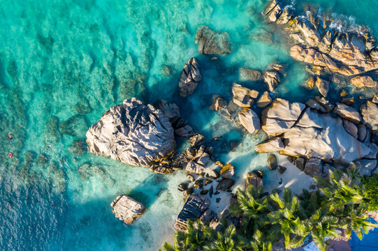 Aerial view of rocks along the coastline facing the Indian Ocean at Anse Severe, La Digue and Inner Islands, Seychelles.
