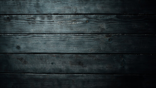 Black wooden texture background. Wood texture after burning. Top view. Free space for your text.