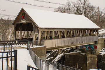 historic covered bridge over the Ottauquechee River in Quechee, Vermont 
