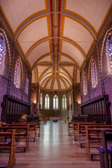 A church hall with benches and large windows in a monastery in the Netherlands
