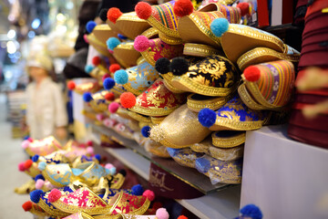 Variety of multicolored shoes Turkish slippers offered for sale on the market Grand Bazaar, Istanbul