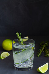 cocktail with mint.close-up Cucumber water with lime. glass of Homemade flavoured lemonade with rosemary on the black table. detox water. cold summer lemonade with copy space.