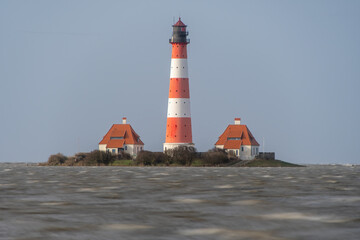 a beautiful lighthouse on the North Sea during storm tide