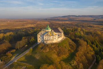 Naklejka premium Olesko Palace from the air. Reserve. Autumn park on the hills. Aerial view of the Olesky Castle, Ukraine.