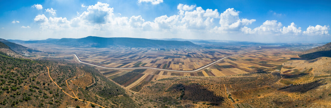 Panoramic aerial view of a stream crossing the countryside, Beit Netofa valley, Israel.