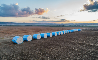 Aerial view of cotton bale in the field at sunrise, Kibbutz Saar, Mate Asher, Israel.