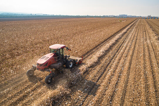 Aerial view of a tractor shredding a field, Kibbutz Saar, Mate Asher, Israel.