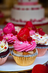 Colorful decorated cupcakes  for sale on candy shop to celebrate Happy Valentine's Day