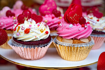 Colorful decorated cupcakes  for sale on candy shop to celebrate Happy Valentine's Day