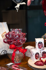 Colorful heart-shaped lollipops for sale on candy shop on Happy Valentine's Day