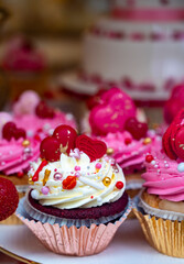 Colorful decorated cupcakes  for sale on candy shop to celebrate Happy Valentine's Day