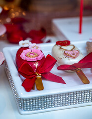 Colorful decorated ice cream cakes  for sale on candy shop to celebrate Happy Valentine's Day