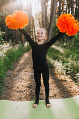 The best, beautiful, smiling girl, a professional athlete, a child cheerleader in a black suit...