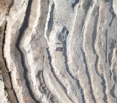 Aerial view of excavator in quarry in Monda, Andalusia, Spain.