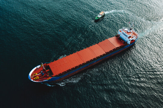 Aerial view of cargo ship leaving the harbour in Valletta, Malta island.