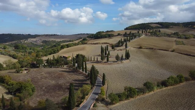 Monticchiello aerial view in Val d'Orcia Tuscany, famous winding cypress road