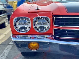 Close up of a red vintage car headlight