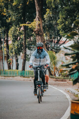 Fototapeta na wymiar person riding a bike