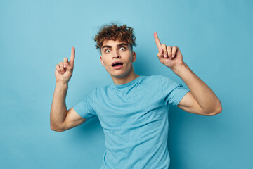 kinky guy in blue t-shirts with a pumped-up body isolated background