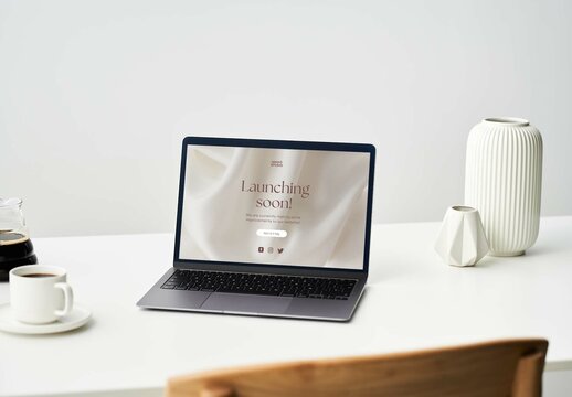 Laptop Mockup on a White Desktop with Coffee