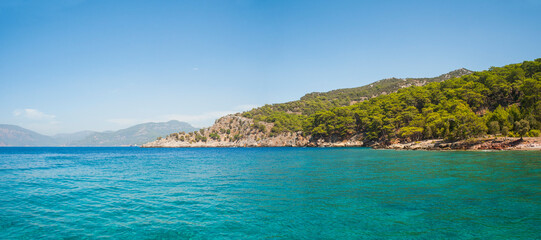 Mediterranean coast and turqouise blue sea water on Mediterranean Sea at Dalyan, Mugla Province, Turkey, Eastern Europe, background with copy space