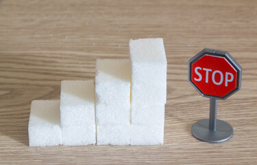 Heap of sugar cubes and stop roadsigns