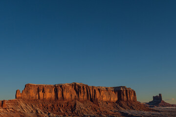 Monument valley in the state of Utah, United States. Navajo Indian Reservation. Wild West. Travel and vacation concept. Reddish desert.