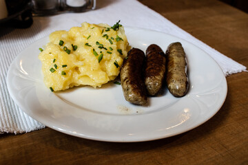 Bavarian smoked sausages and warm potato salad
