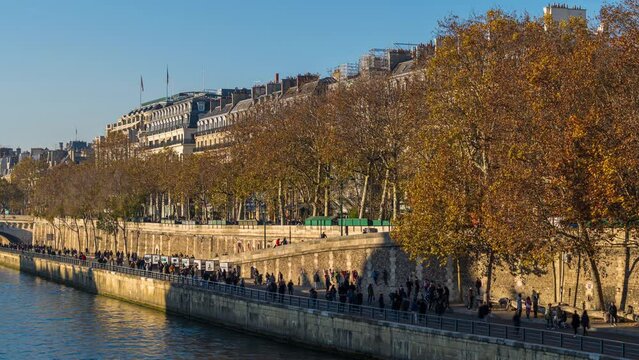 Tourists Walking on the Seine Docks With Fall Colors Paris Sunny Day