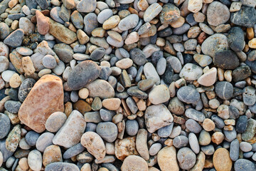 gray pebbles. pebble beach. stones for landscape design. background.