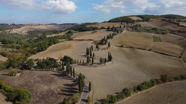 Monticchiello aerial view in Val d'Orcia Tuscany, famous winding cypress road