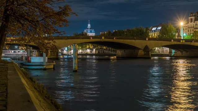 Boats Moving Over the Seine River in Paris at Night