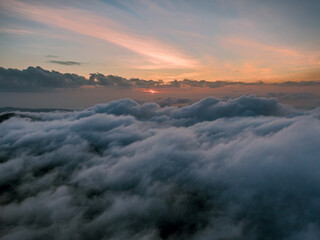 Aerial droen view of beautiful clouds with sunset  in mountain