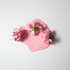 Creative composition with pastel pink flowers melting. Minimal spring nature concept.
