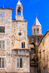 Fototapeta na wymiar Croatia travel and landmarks. Split -ancient roman well preserved city. View of tower with clocks in downtown