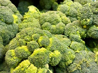 A group of green broccoli in the market