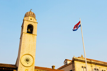 Obraz premium Photo of Dubrovnik City Bell Tower and the Croatian flag, Dubrovnik, Dalmatia, Croatia